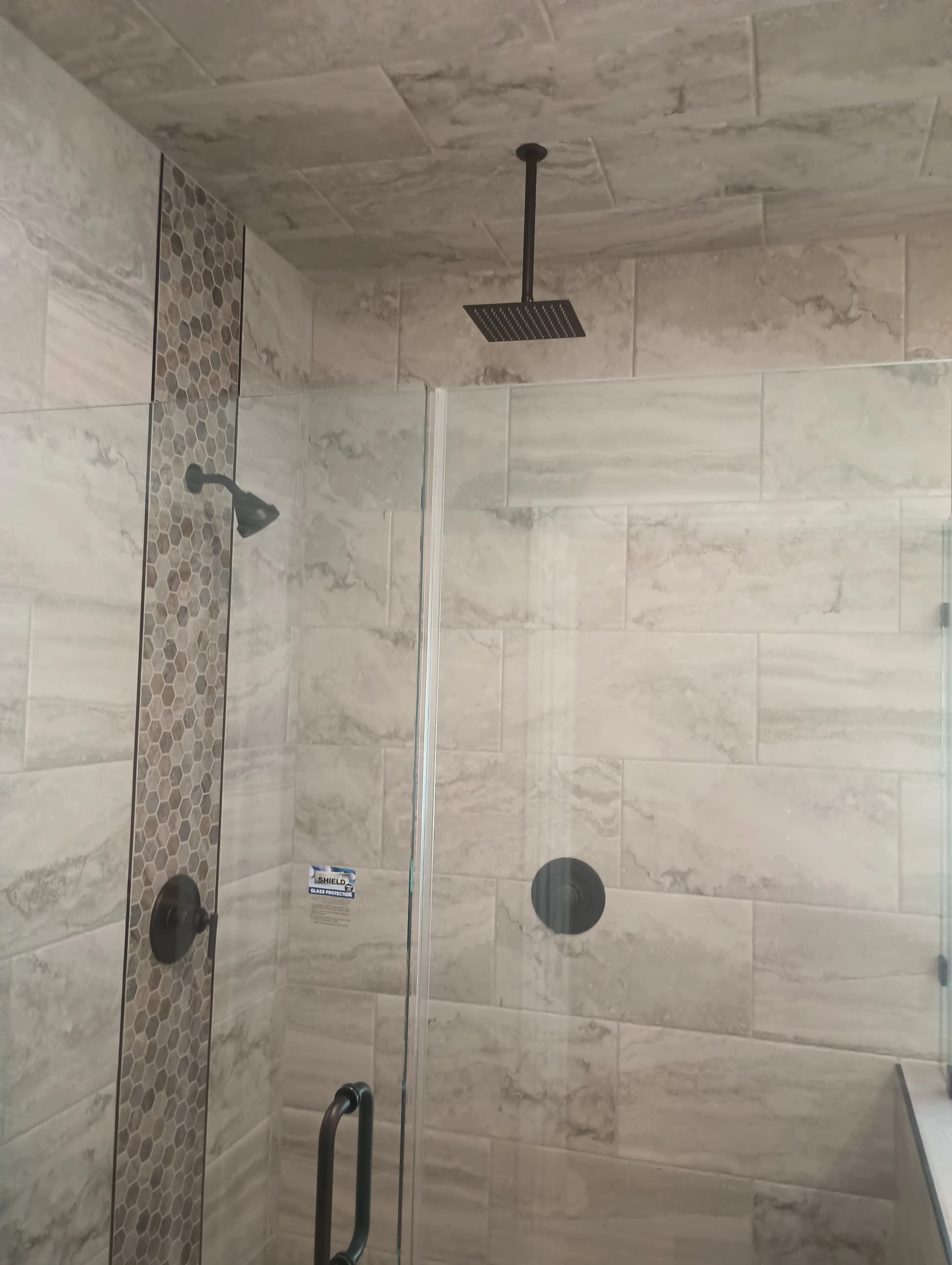 Rainfall shower with vertical hexagon accent strip